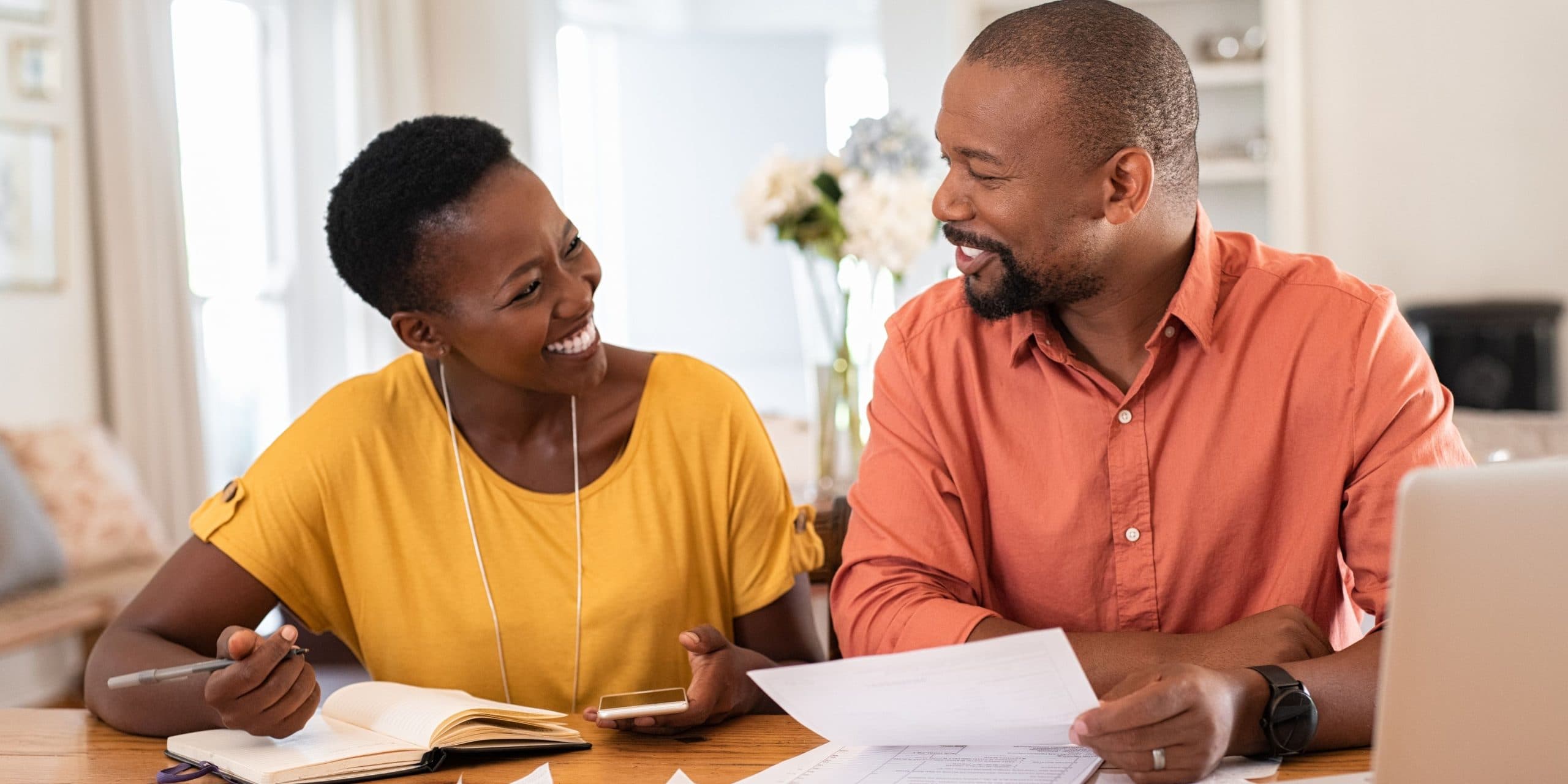 A couple reviewing their finances together at home